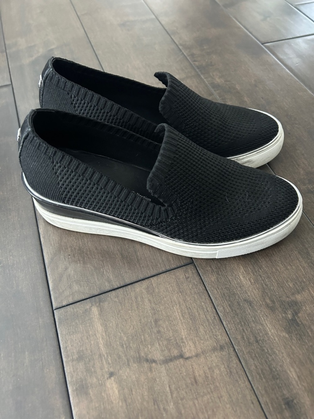 The WISHBONE Slip-On Wedge Sneakers in Black